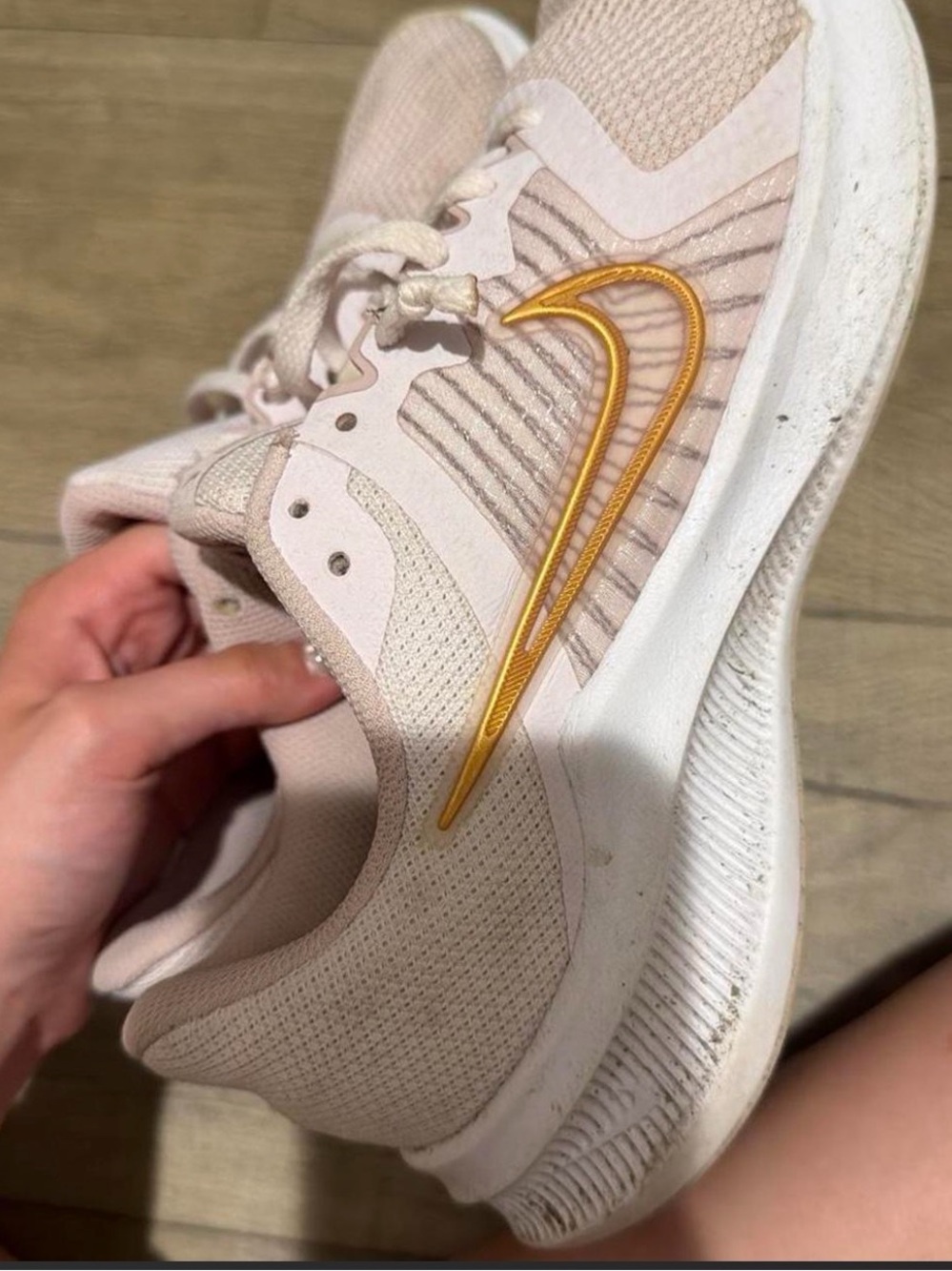 Nike Women's Light Pink Athletic Running Shoes with Gold Swoosh